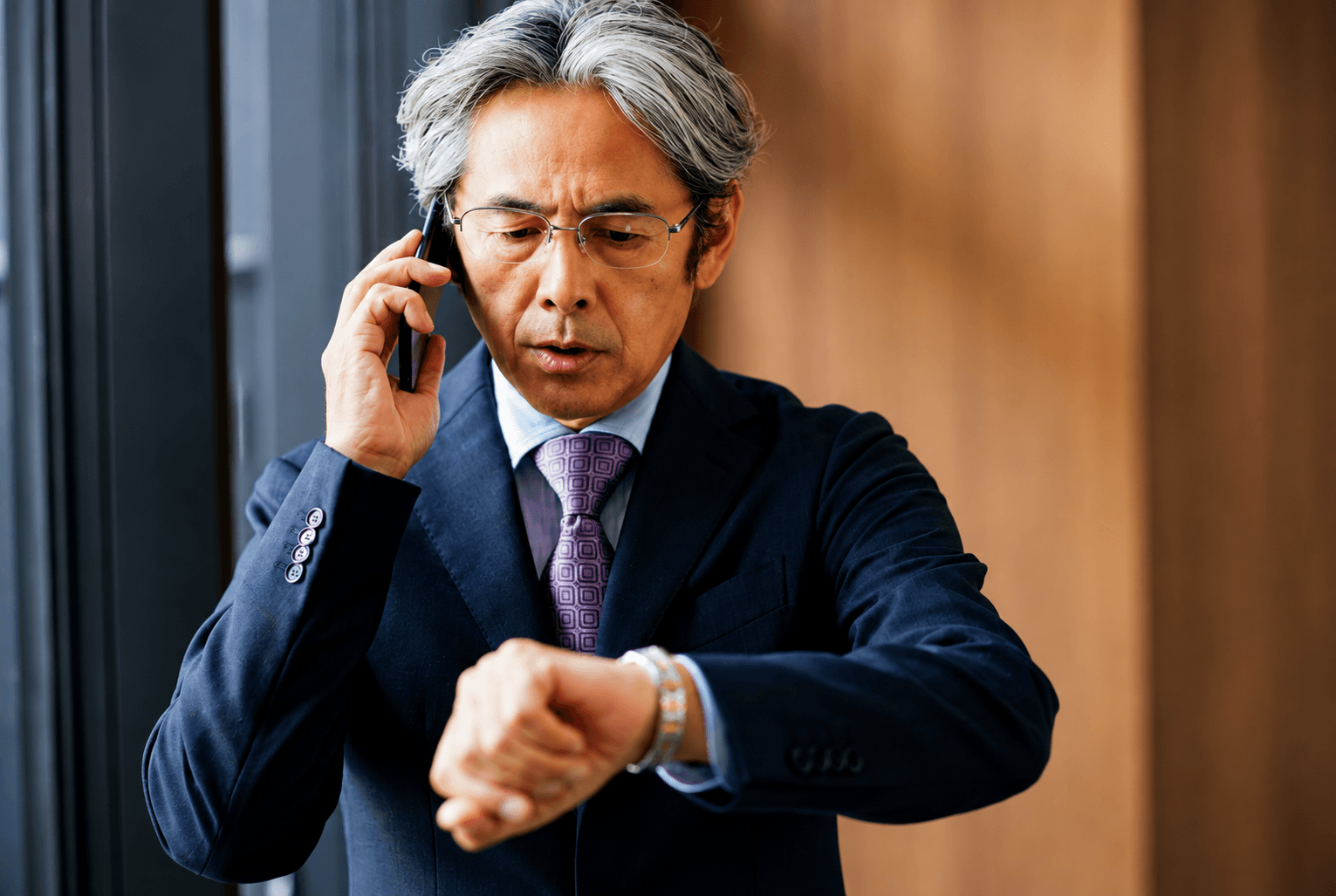 A professional checking the time on a wristwatch