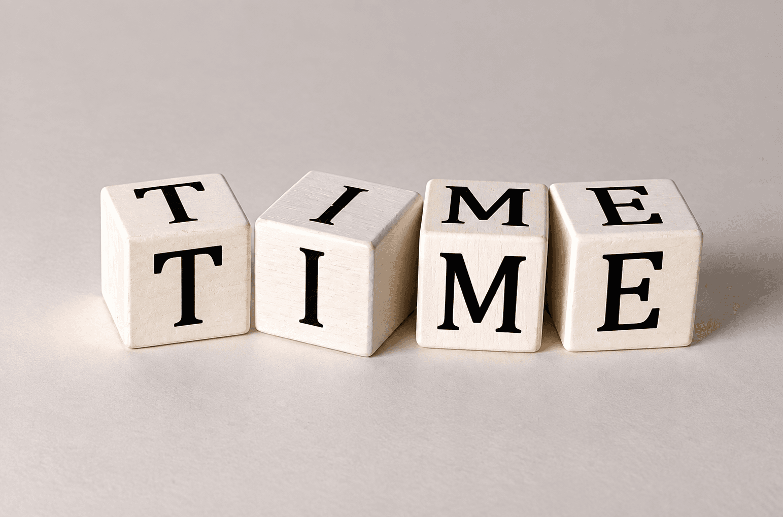 Wooden blocks spelling the word TIME